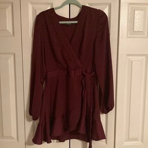 Lulus wrap dress. Size large. Maroon or wine colored. Flowy hem. Long sleeves